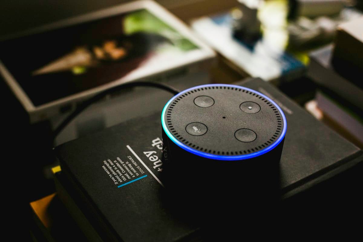 Voice assistant speaker responding in a darkened room